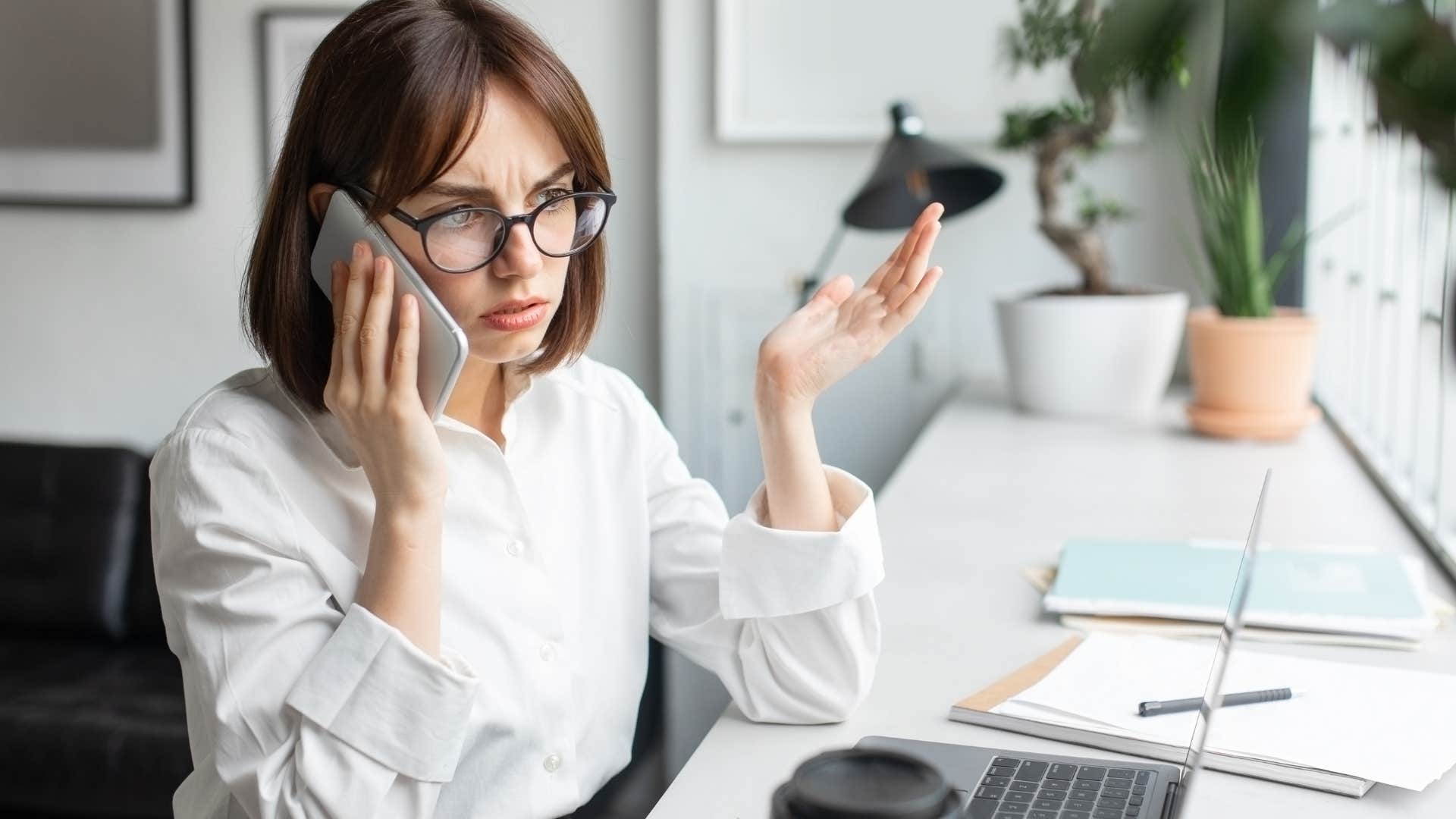 woman who's assumed to be arrogant looking annoyed at work