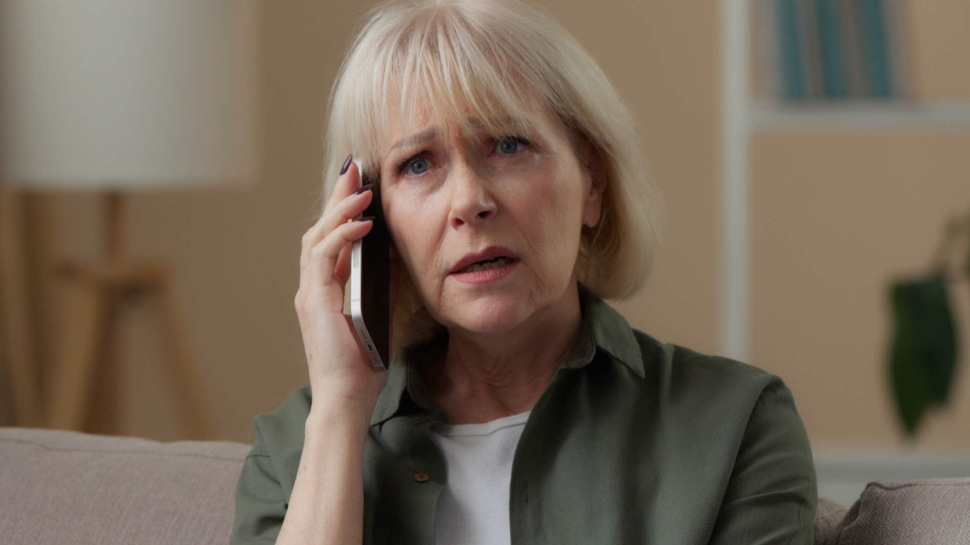 intelligent woman rejected by most of society not wanting to gossip on the phone