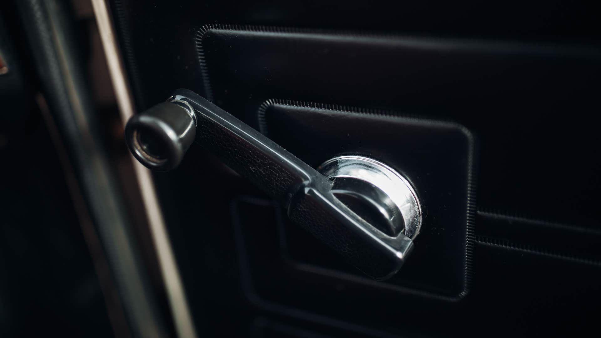 vintage car window crank used to roll down window