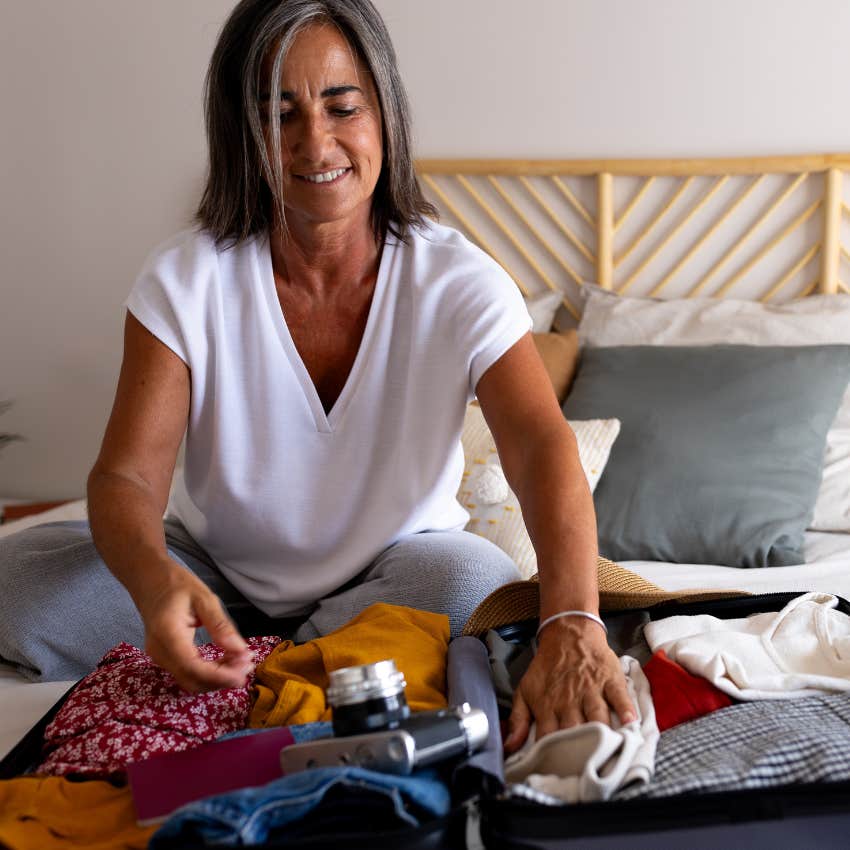 working woman packing vacation less likely stressed depressed