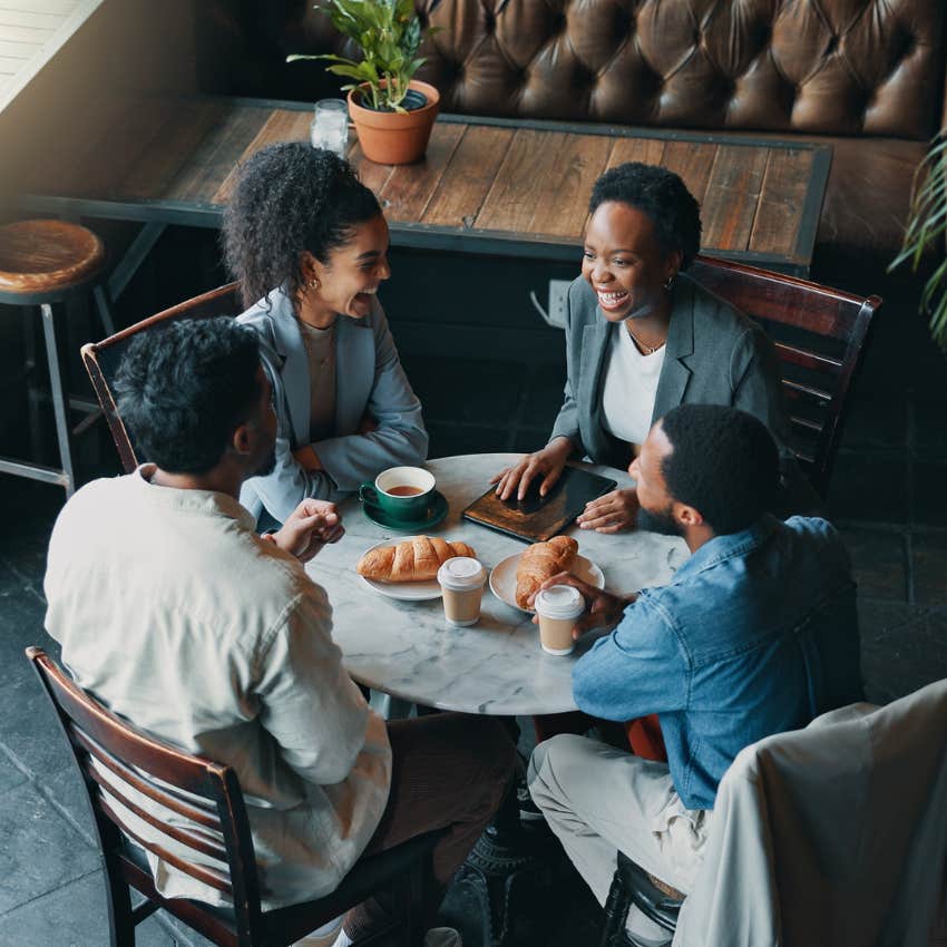 friends enjoying meal at a restaurant with phone ban