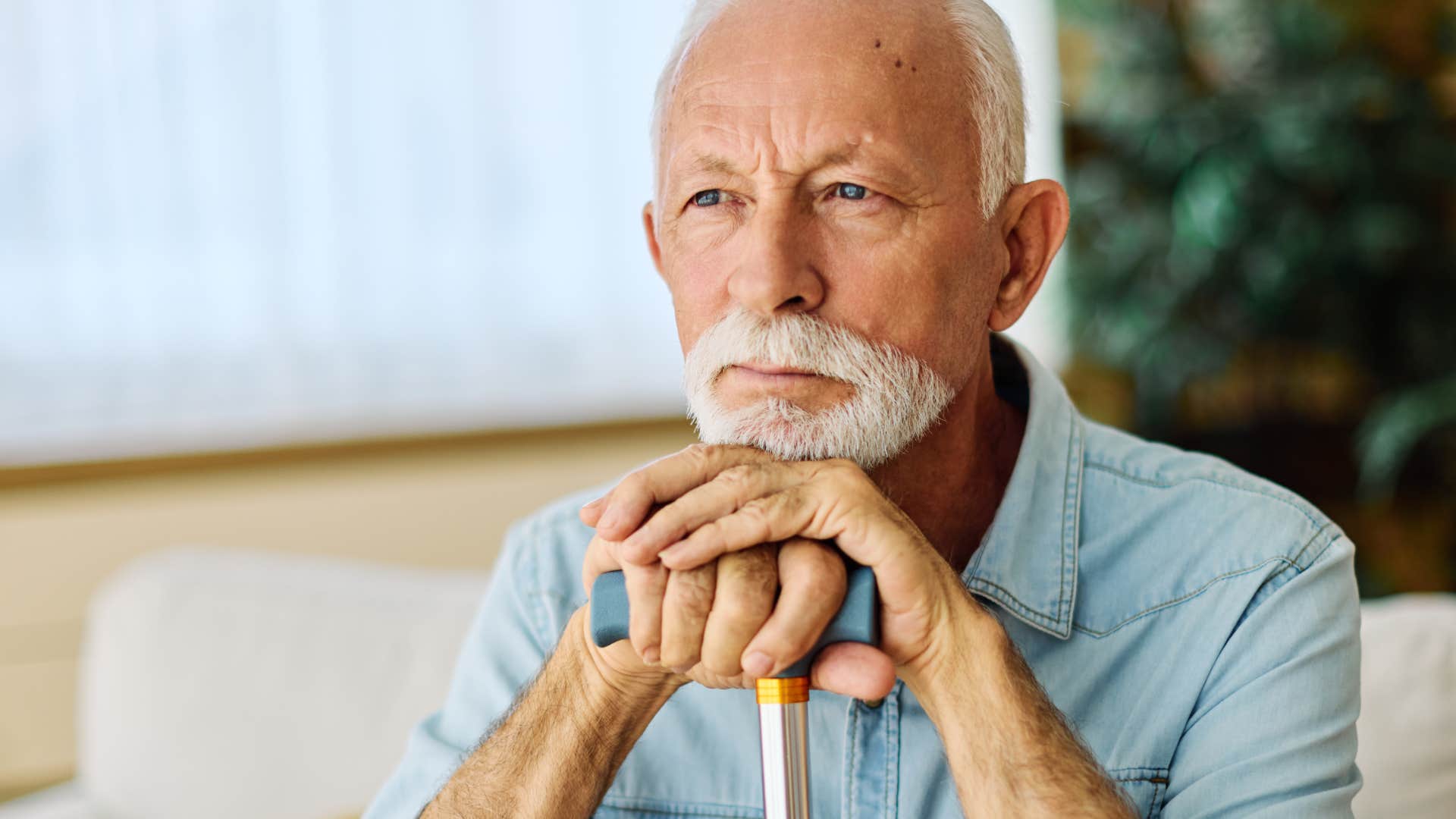 older man coming to sad realizations while downsizing his home