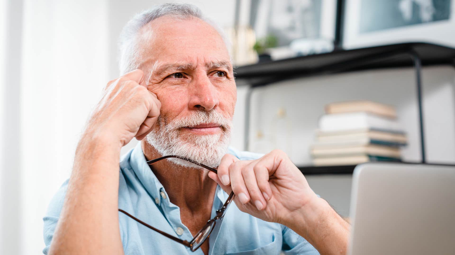 older man having trouble letting go of his home thinking
