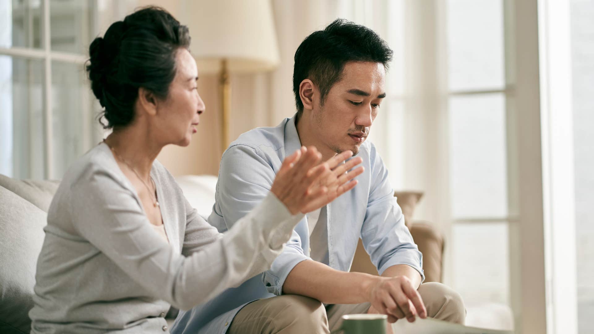 older mother berating her son saying you should be grateful