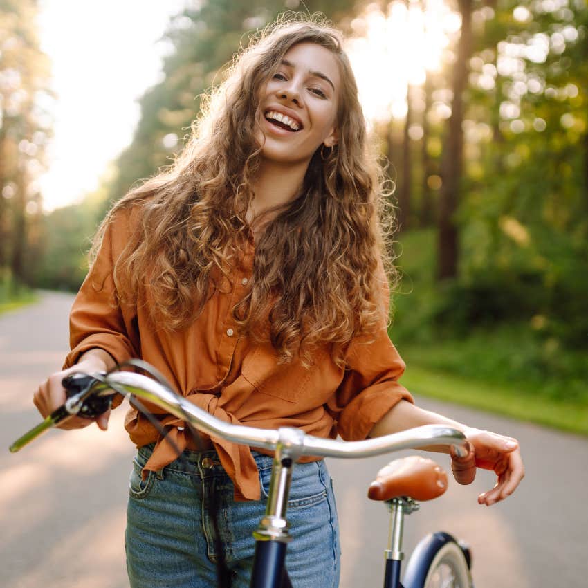 healthy woman on a bike ride enjoying her three-day weekend