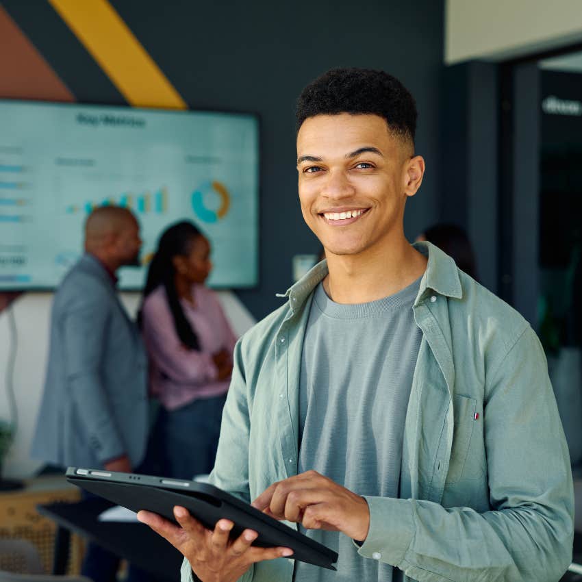 happy man at work who likes his job and is more productive because every weekend is a 3-day weekend
