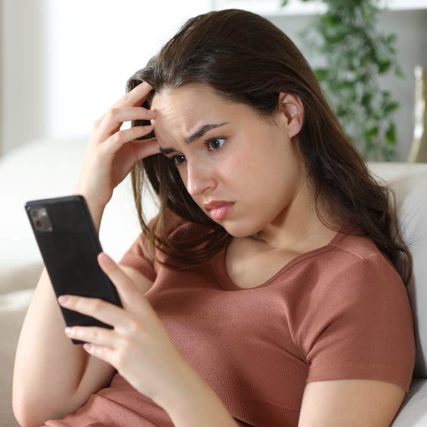 concerned mom looking at smartphone