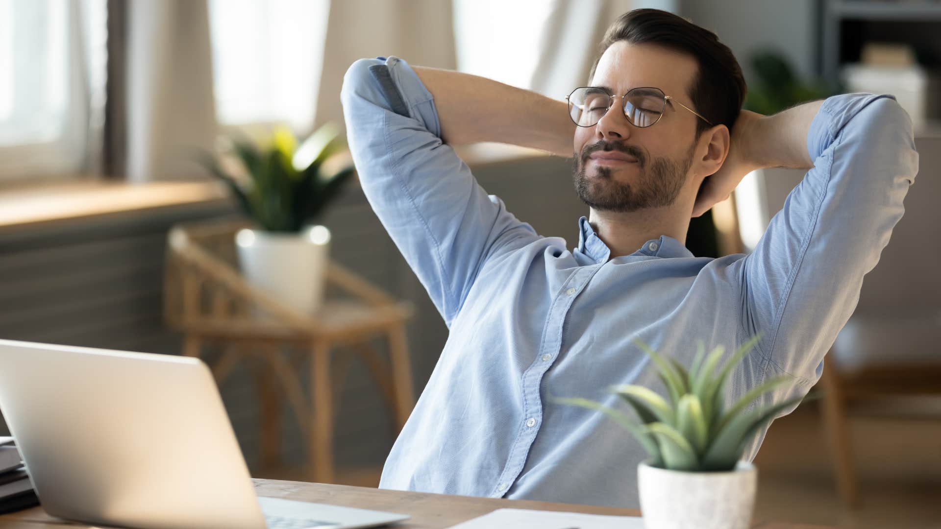 man closing his eyes and relaxing not feeling the need to escape his reality