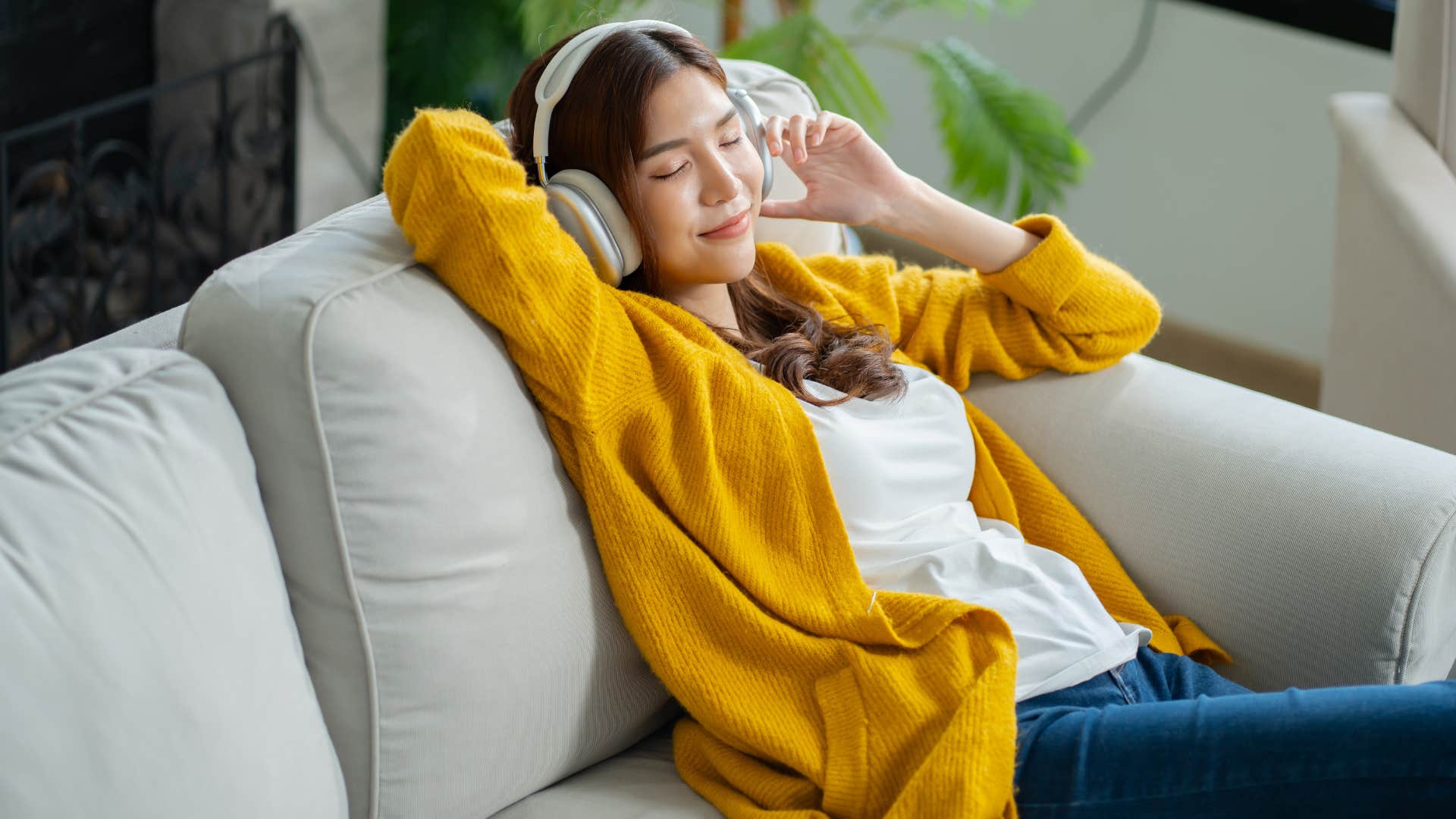 woman listening to music relaxing during quiet moments at home