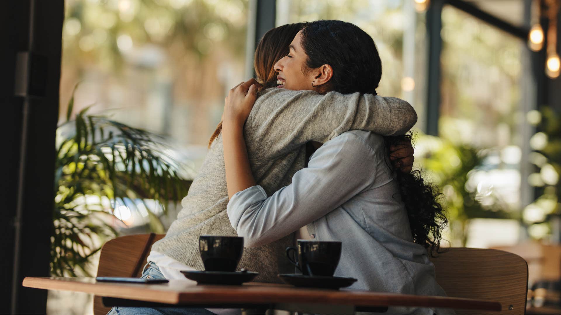 friends hugging feeling grateful everyday for their happiness