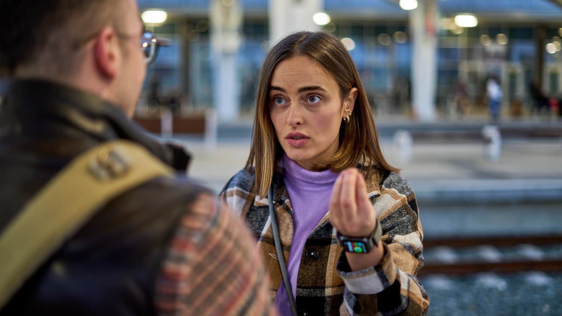 woman in spiritual psychosis passionately explaining her beliefs to man