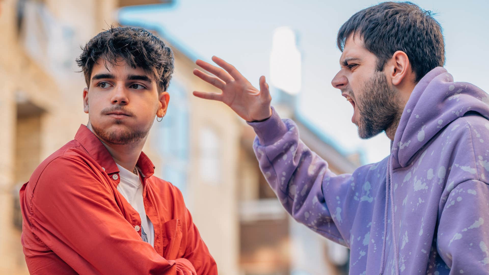 man in spiritual psychosis getting angry lashing out at friend who challenged him