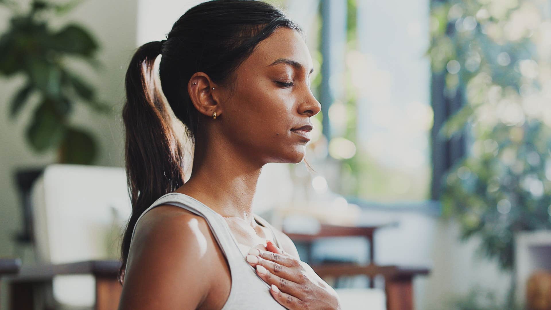meditating woman acknowledging her emotions as they arise