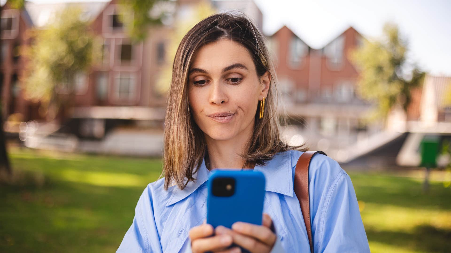 woman taking a pause before responding on text