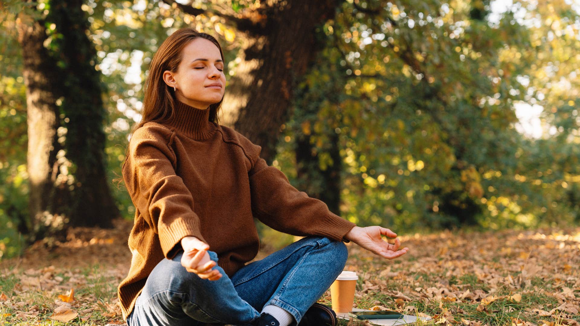 woman staying grounded in her energy meditating