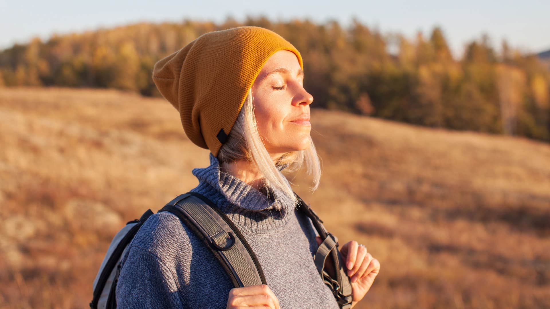 woman on a hike stepping away from life to reset