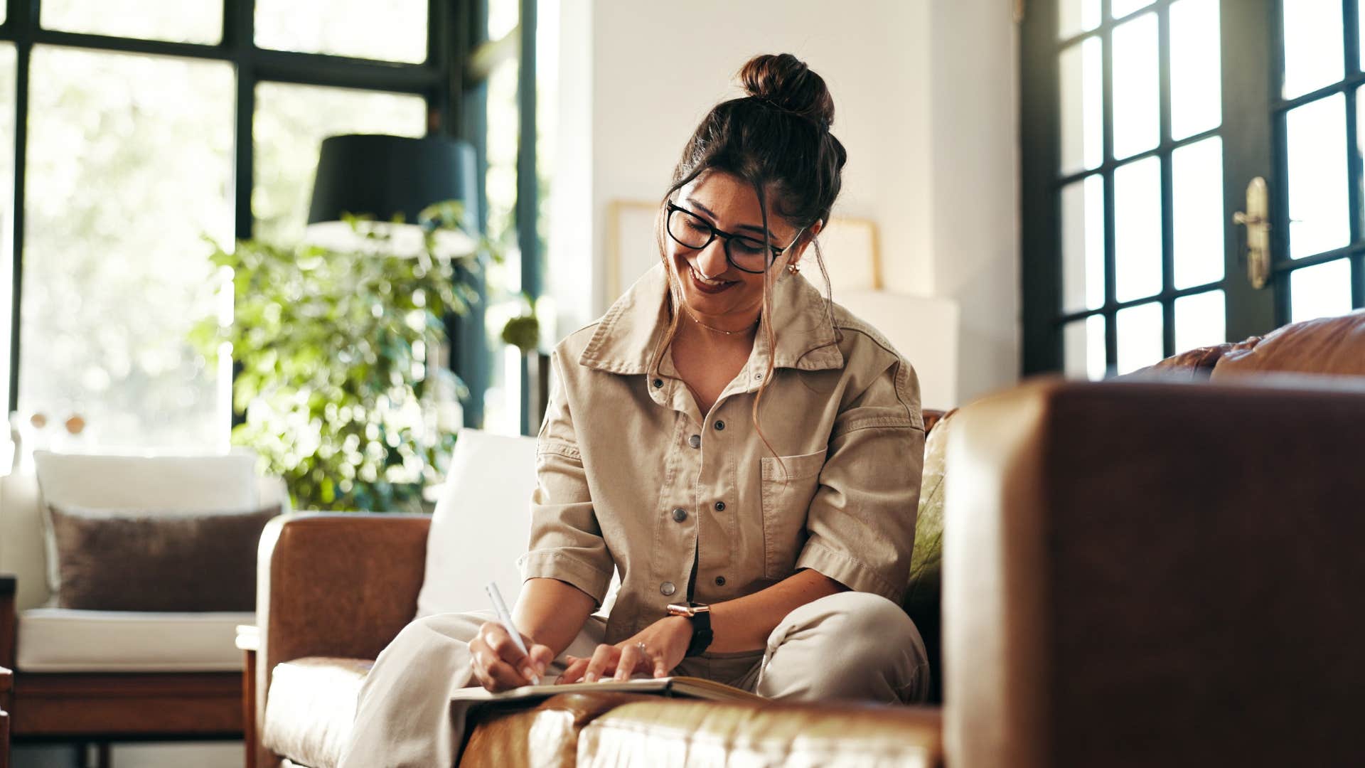 woman keeping her goals private writing in calendar