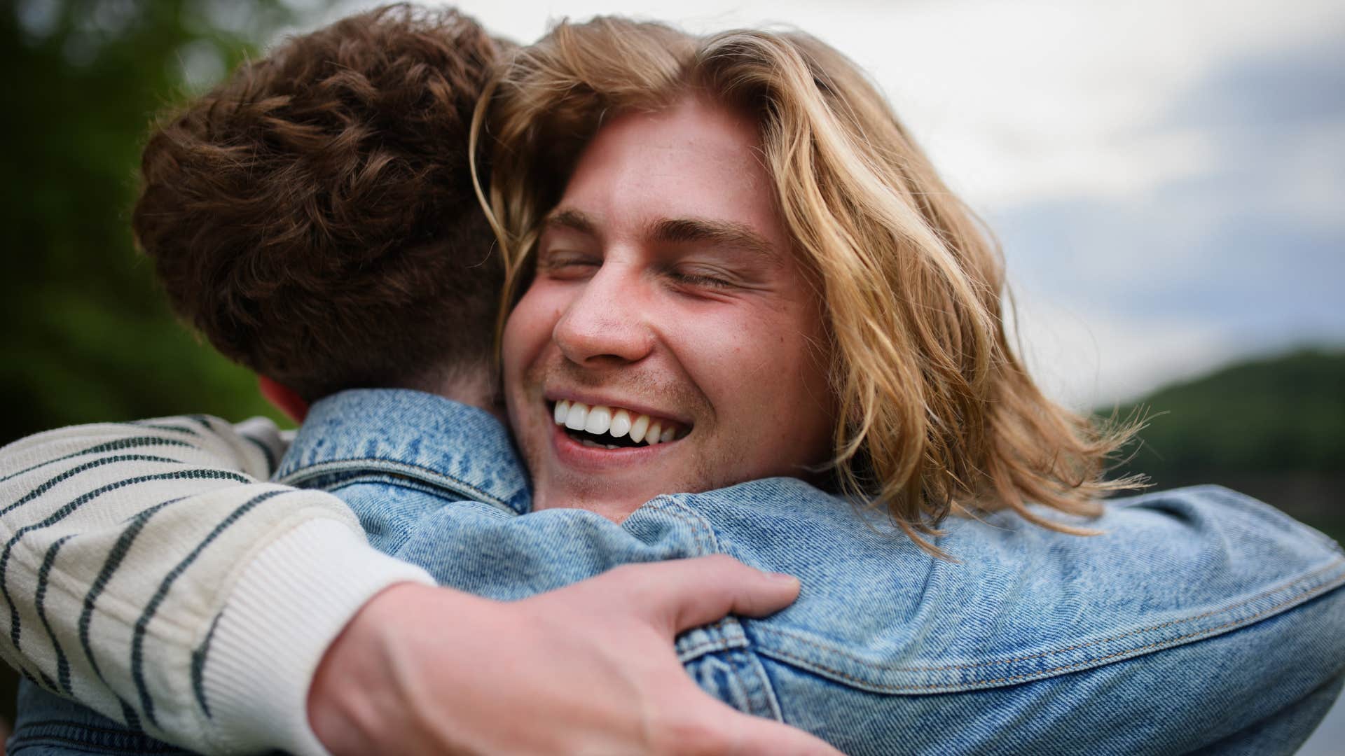 smart man who is selective about his friends hugging his bestie