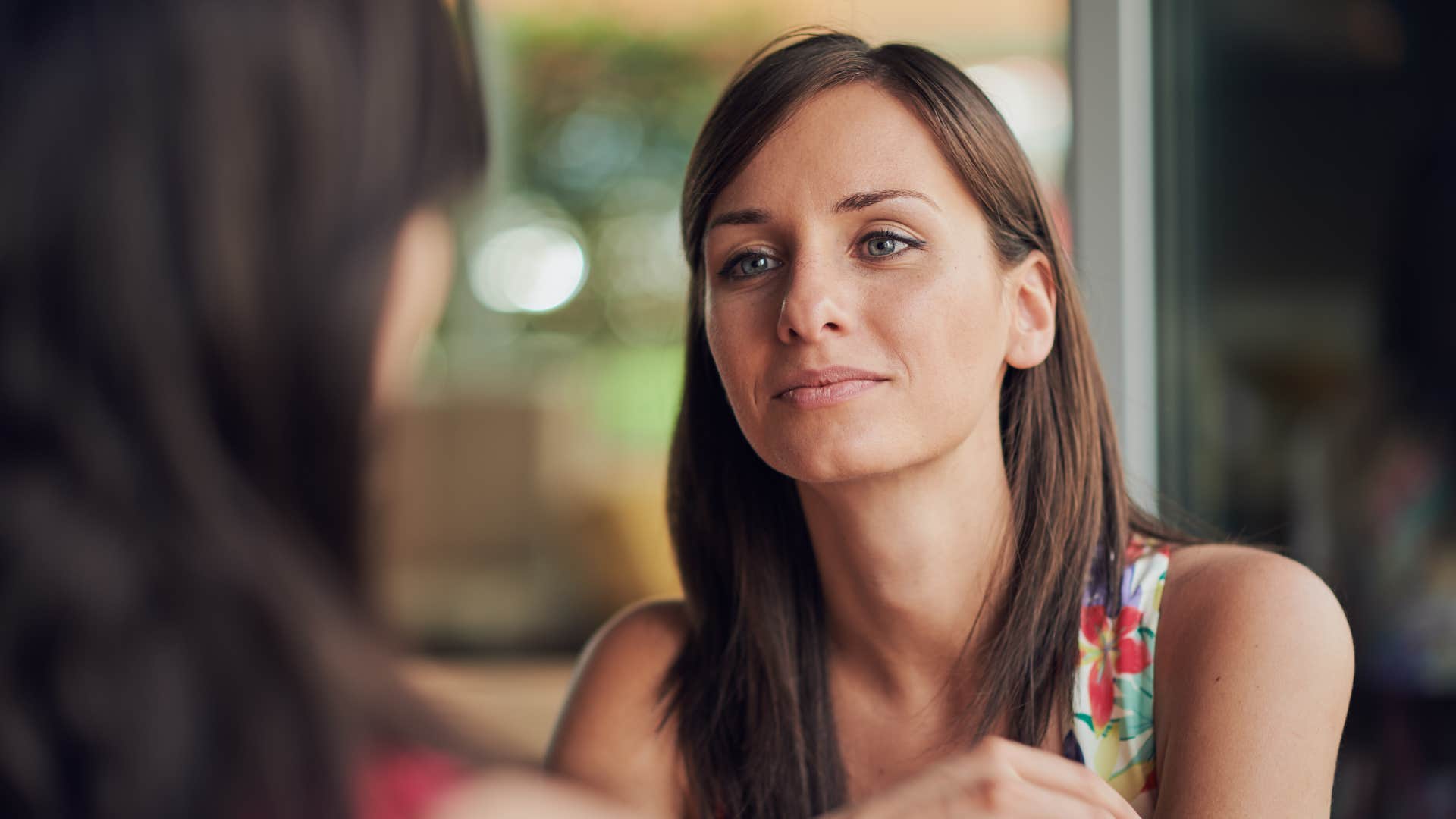 woman talking to acquaintance not chasing closure
