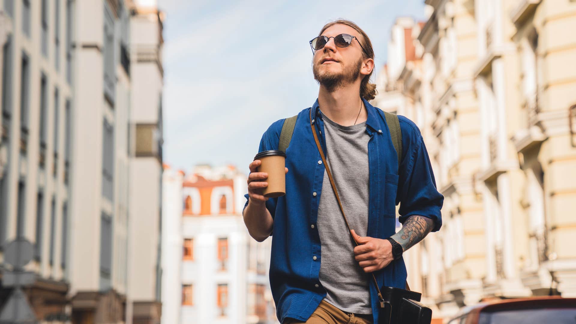 intelligent man taking a walk in town