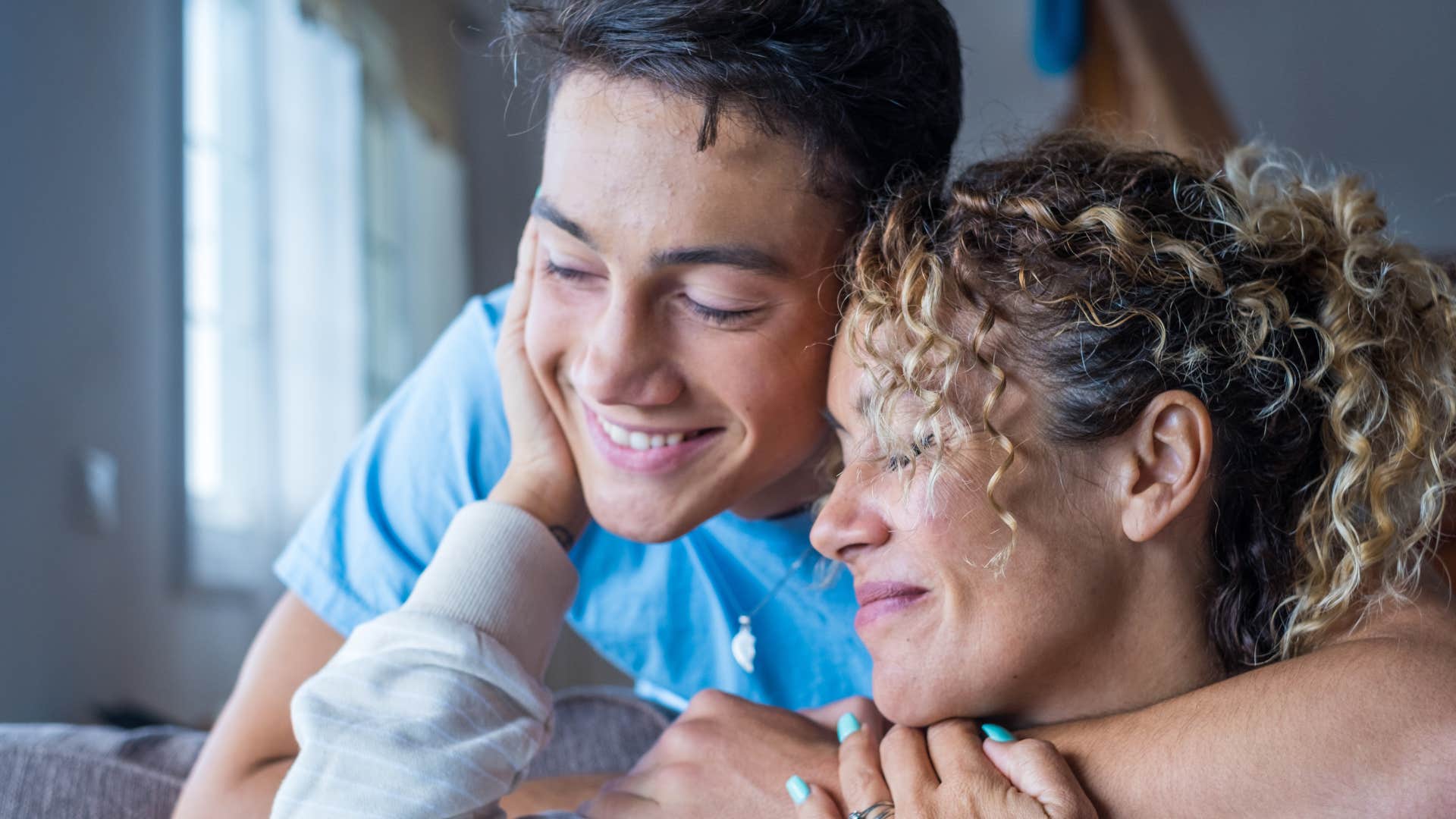 kind young man hugging his mother without expecting praise