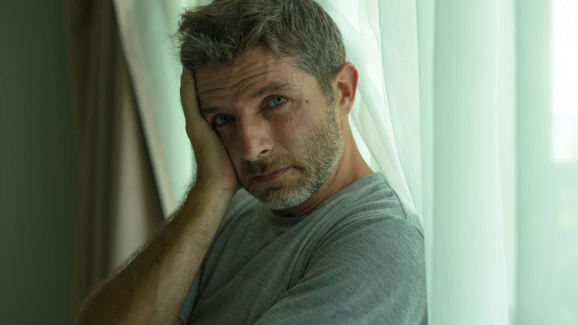 kind man feeling things incredibly deeply looking sad