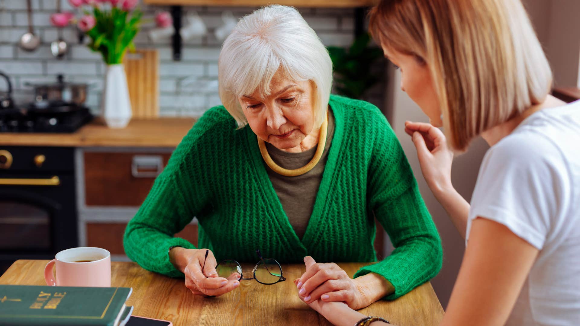 stressed older woman being kind to friend despite her circumstances