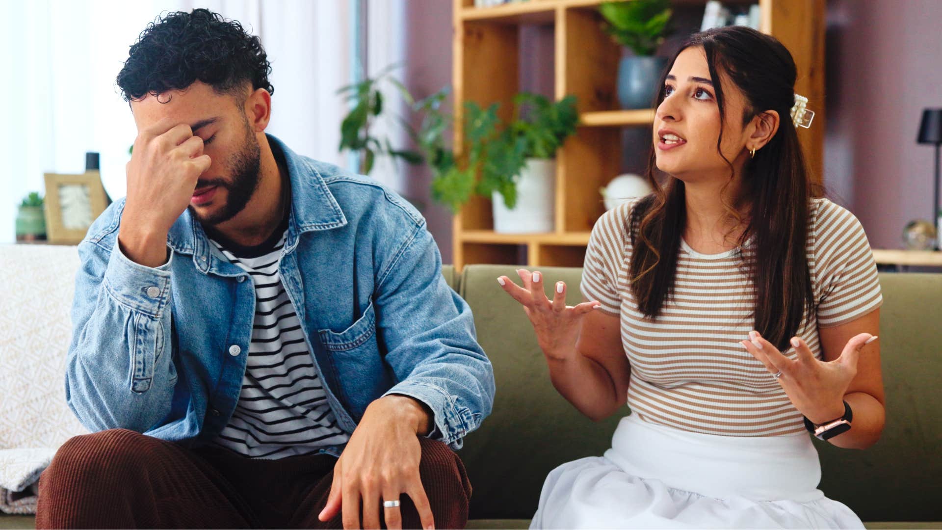 woman yelling at man you're too sensitive as man looks done on couch