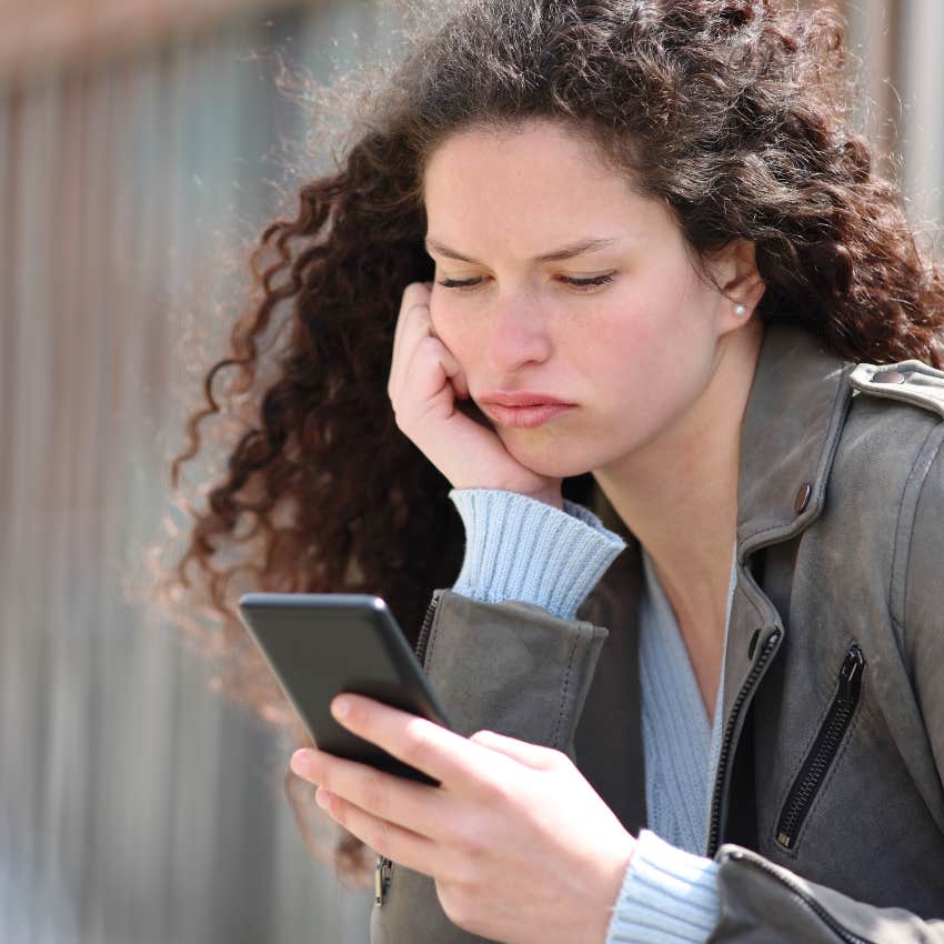 high-iq woman struggling reading texts on her phone