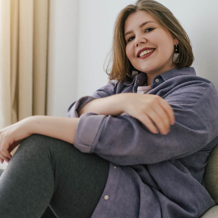 Woman shifting out of fear with positive self-touch at home