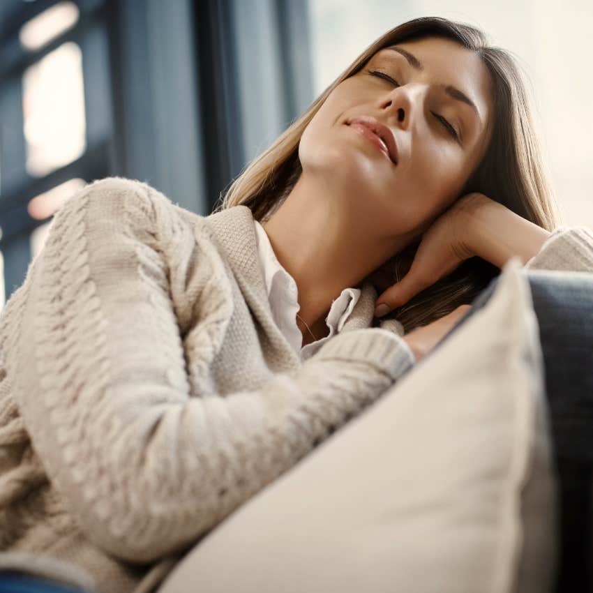 Woman visualizing a text or call coming through at home