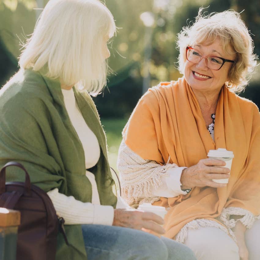 spiritually gifted woman telling friend I don't have the words to explain and smiling