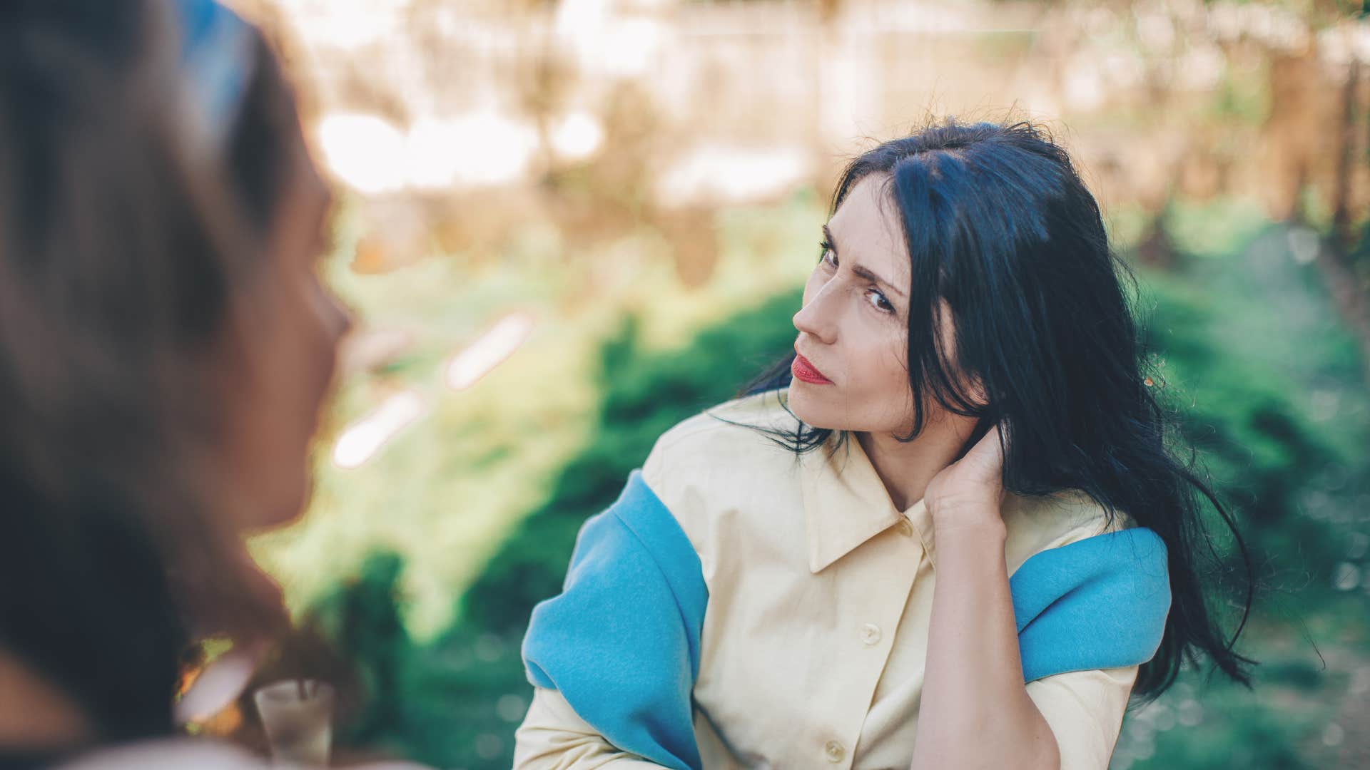 woman hesitating to answer how she's doing after experiencing loss