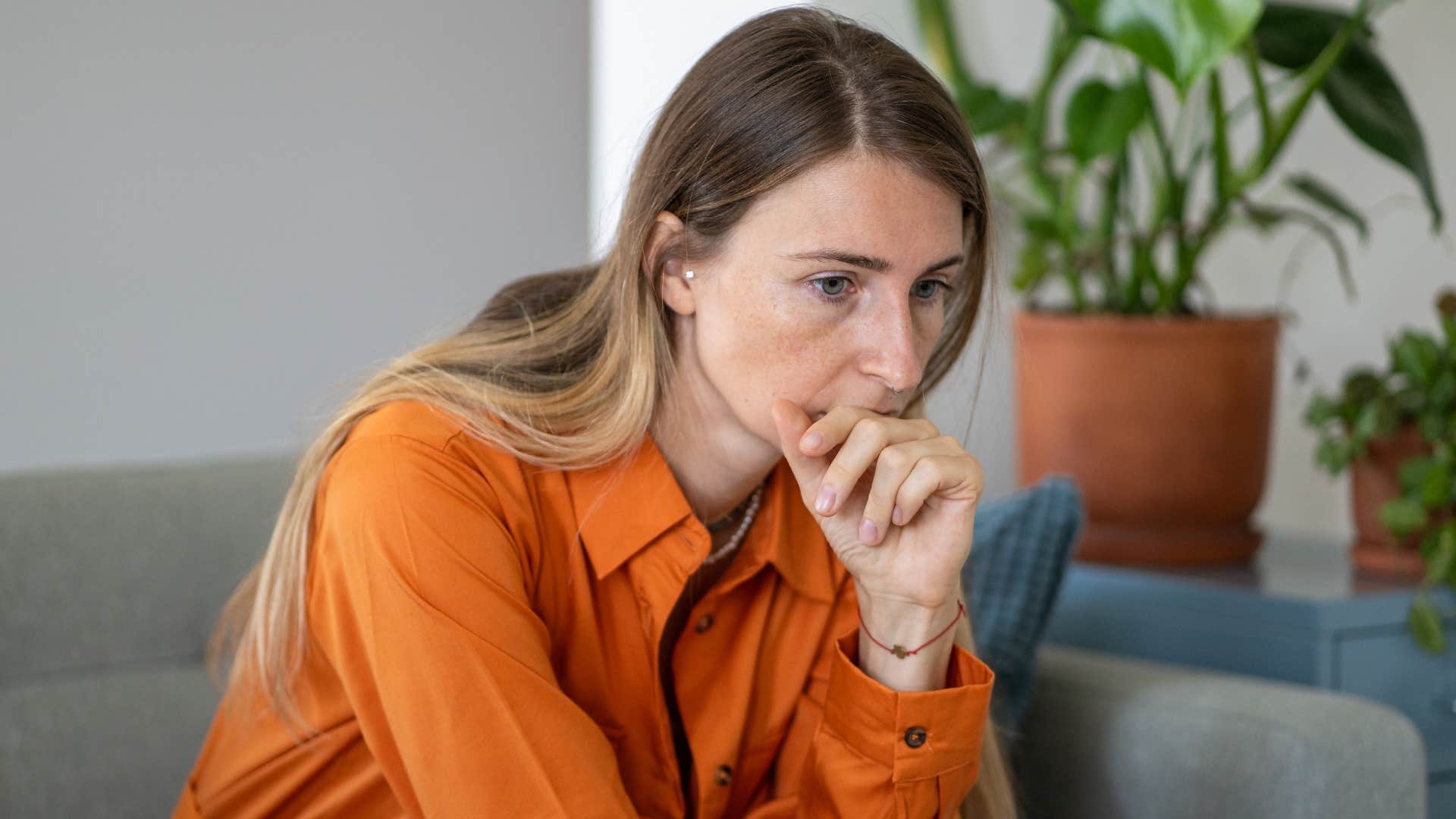 quiet woman sitting alone grieving