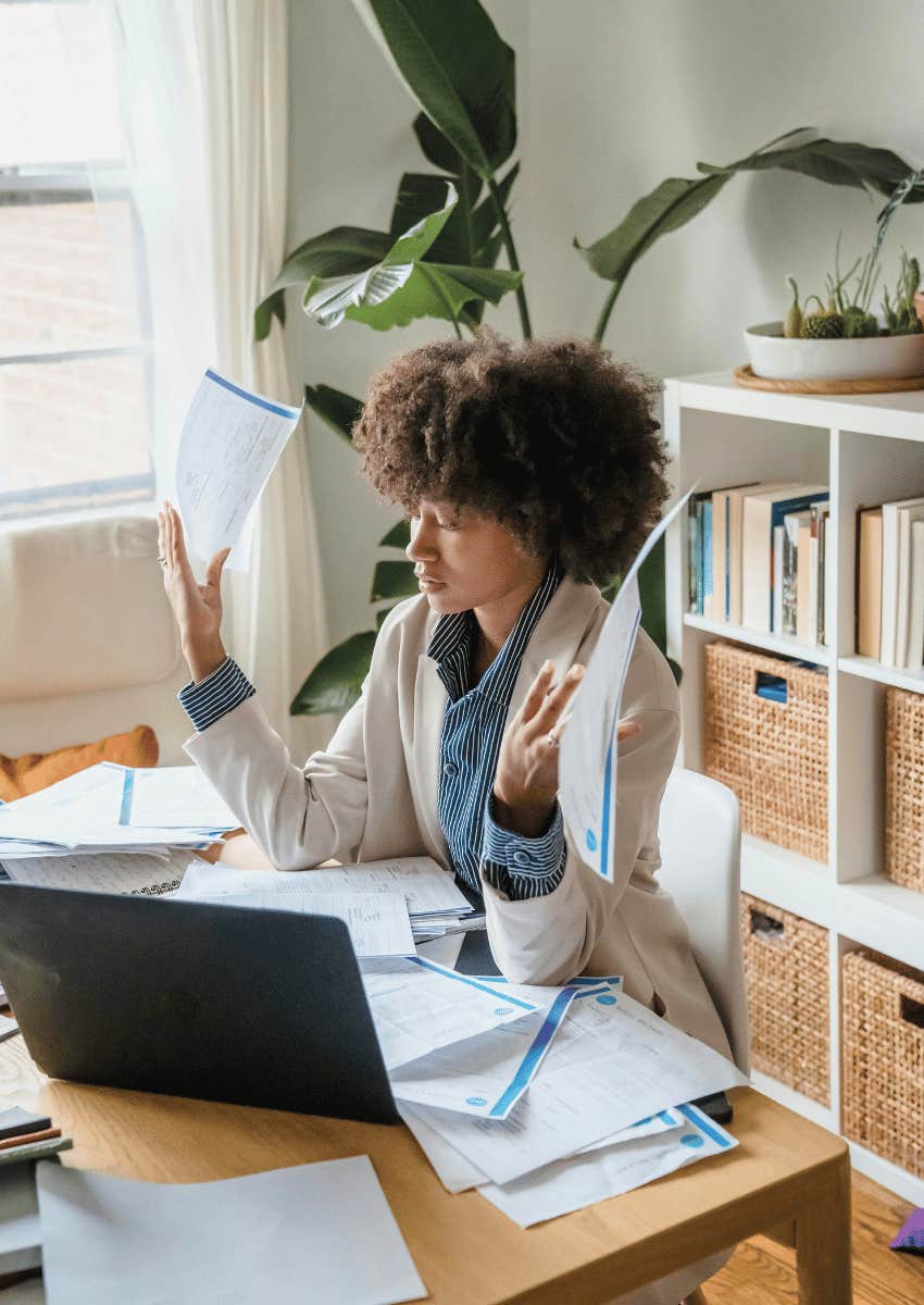 stressed professional woman juggling multiple work tasks