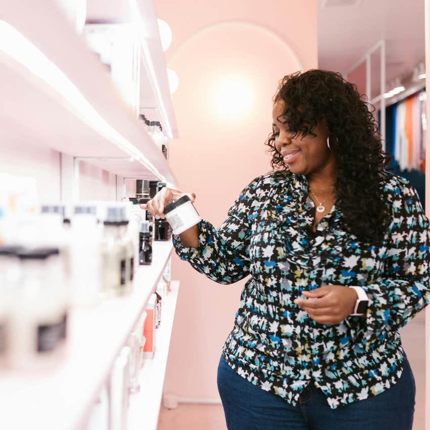 woman concerned about prices while shopping for beauty products