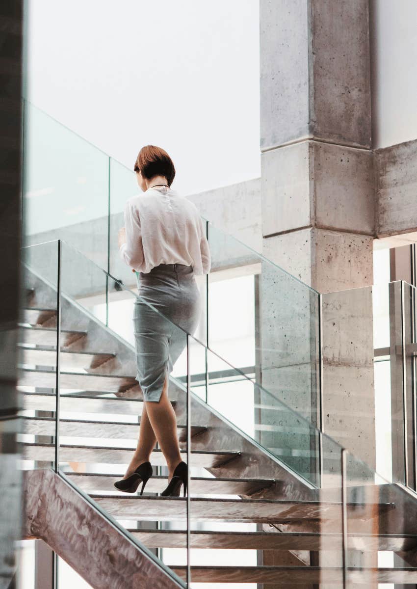 successful woman taking steps toward her goals