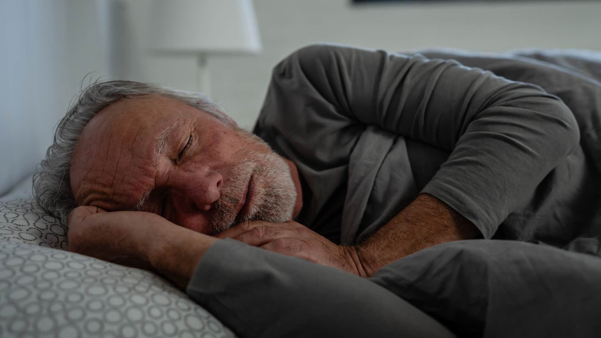Man sleeping in fetal position