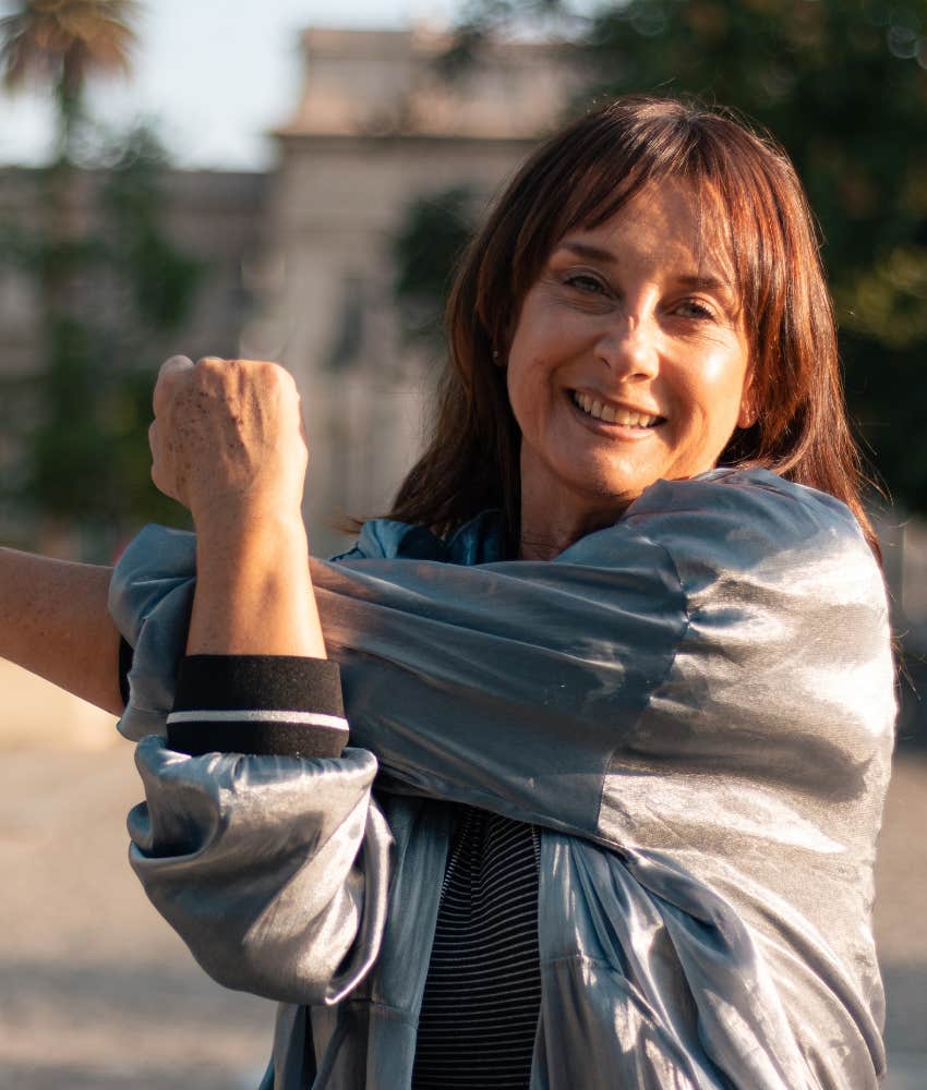 older person stretches arm