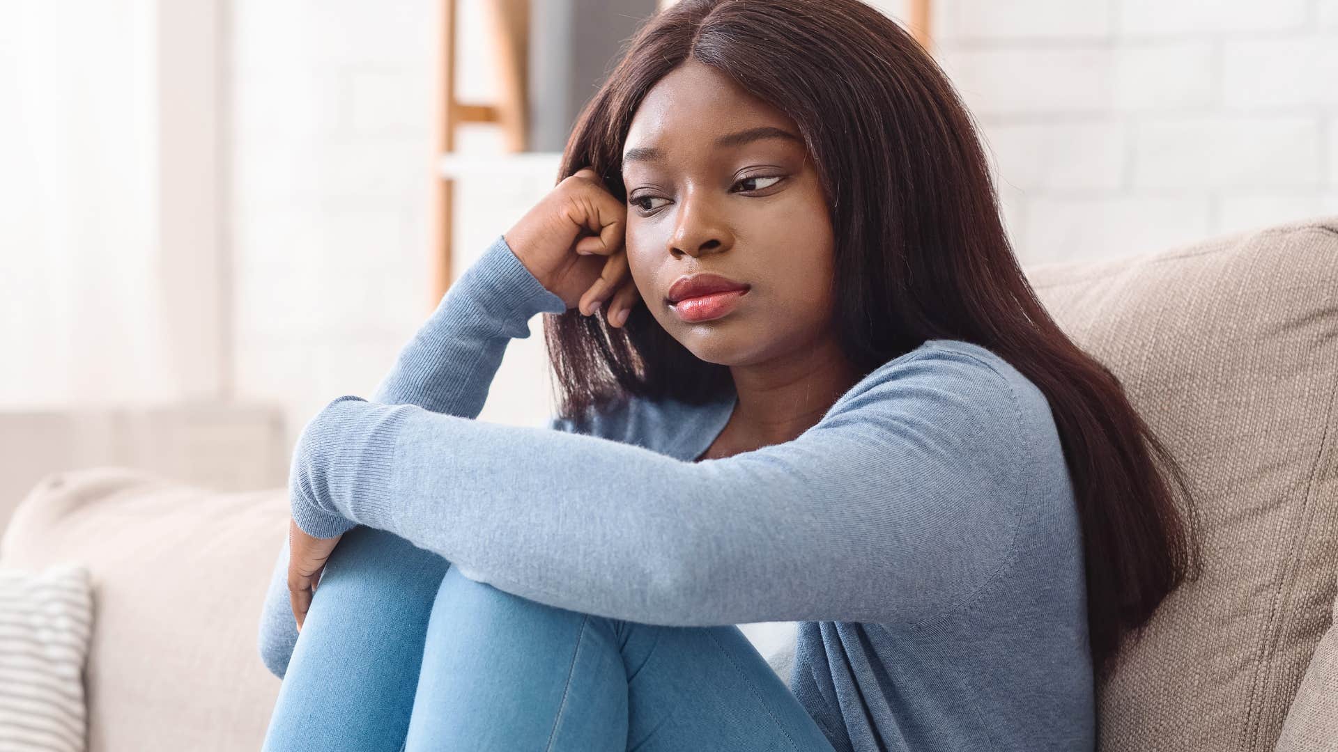 young american woman feeling stressed and pressured to be productive