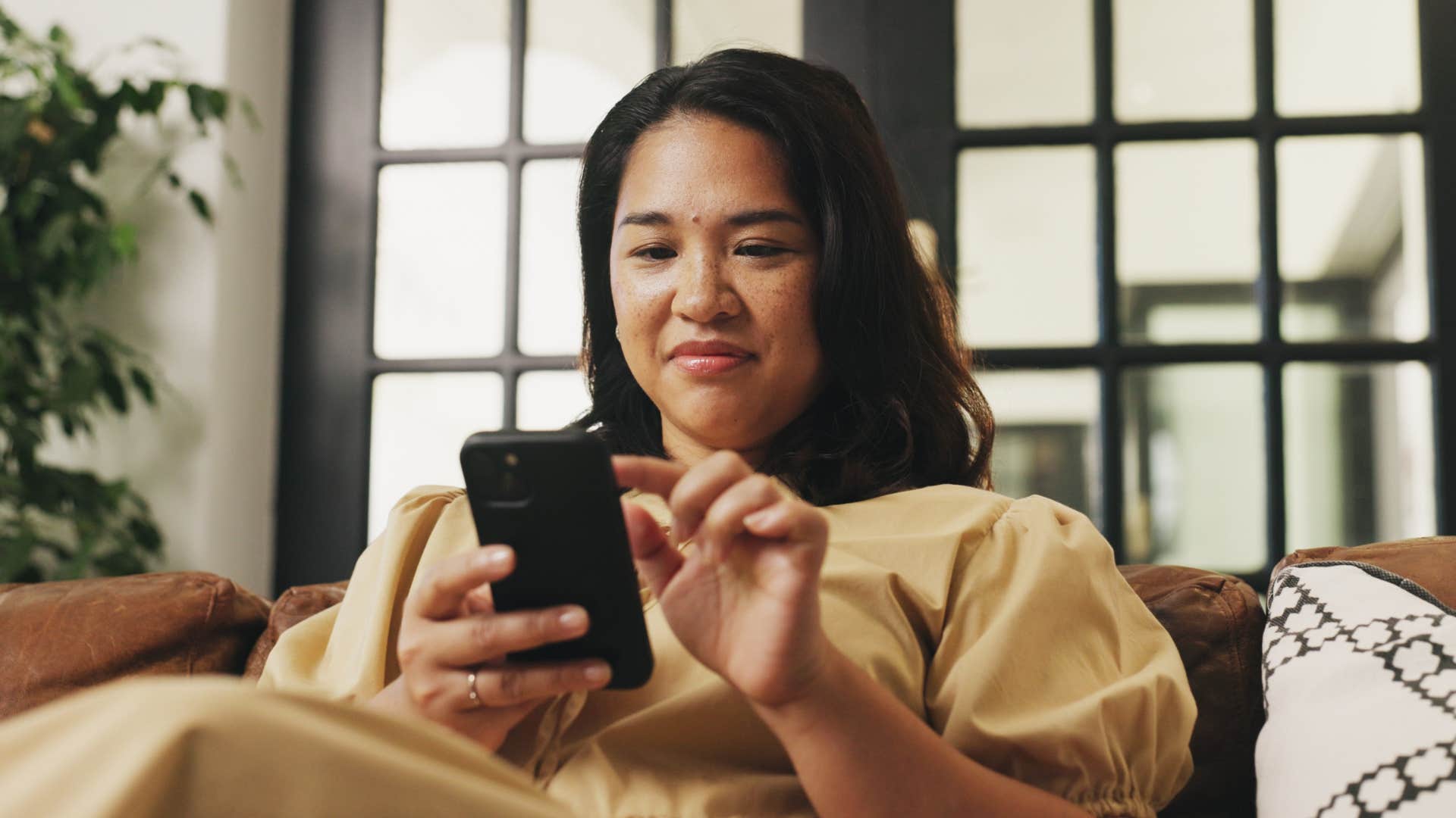 american woman analyzing her text messages