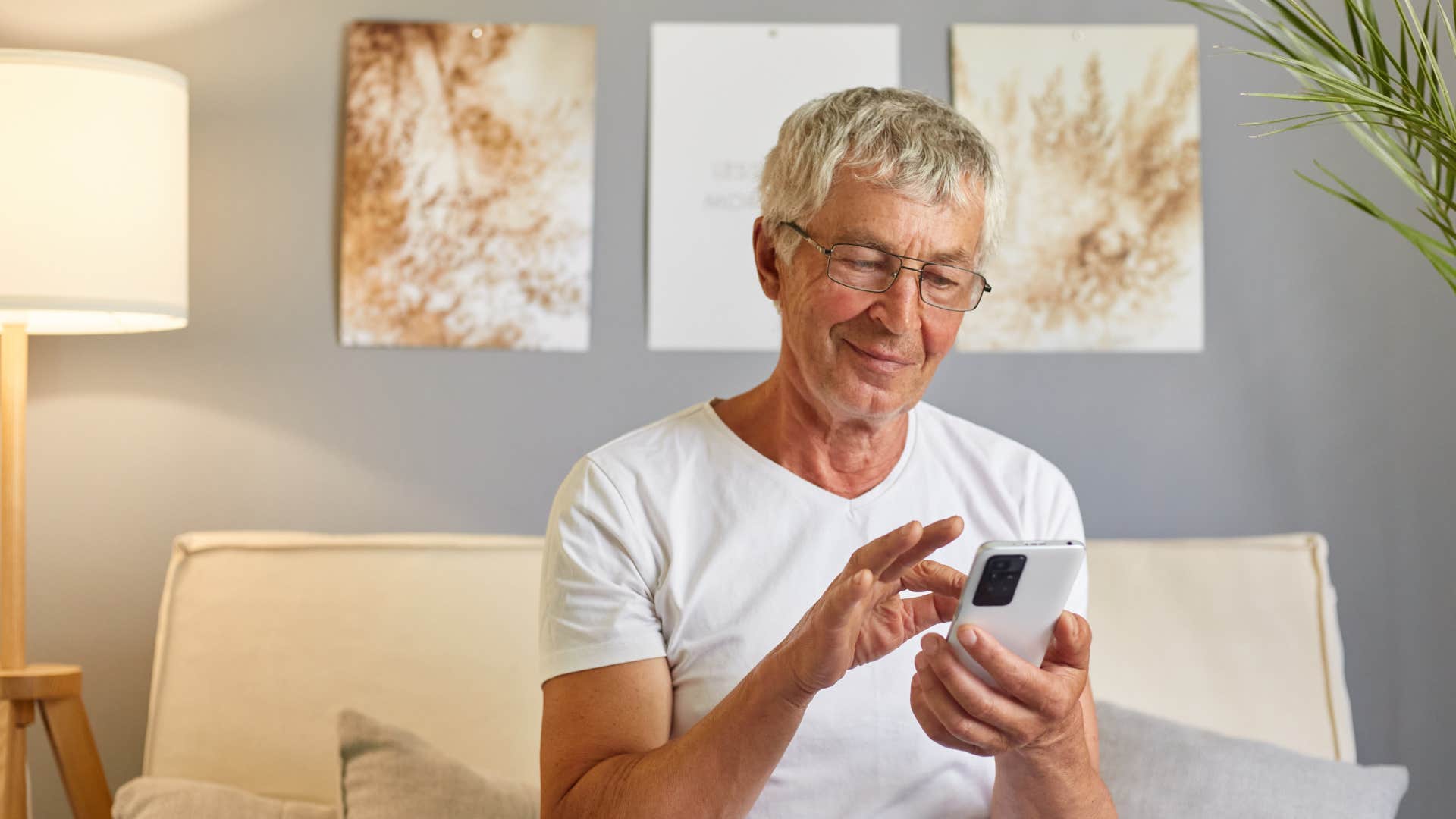 boomer man typing on his phone in all caps
