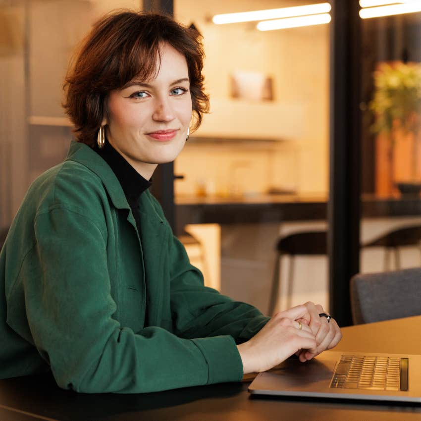 Gen Z woman finding meaning at work smiling