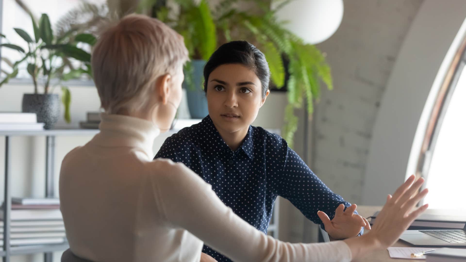 older boss using confusing corporate lingo with gen z worker