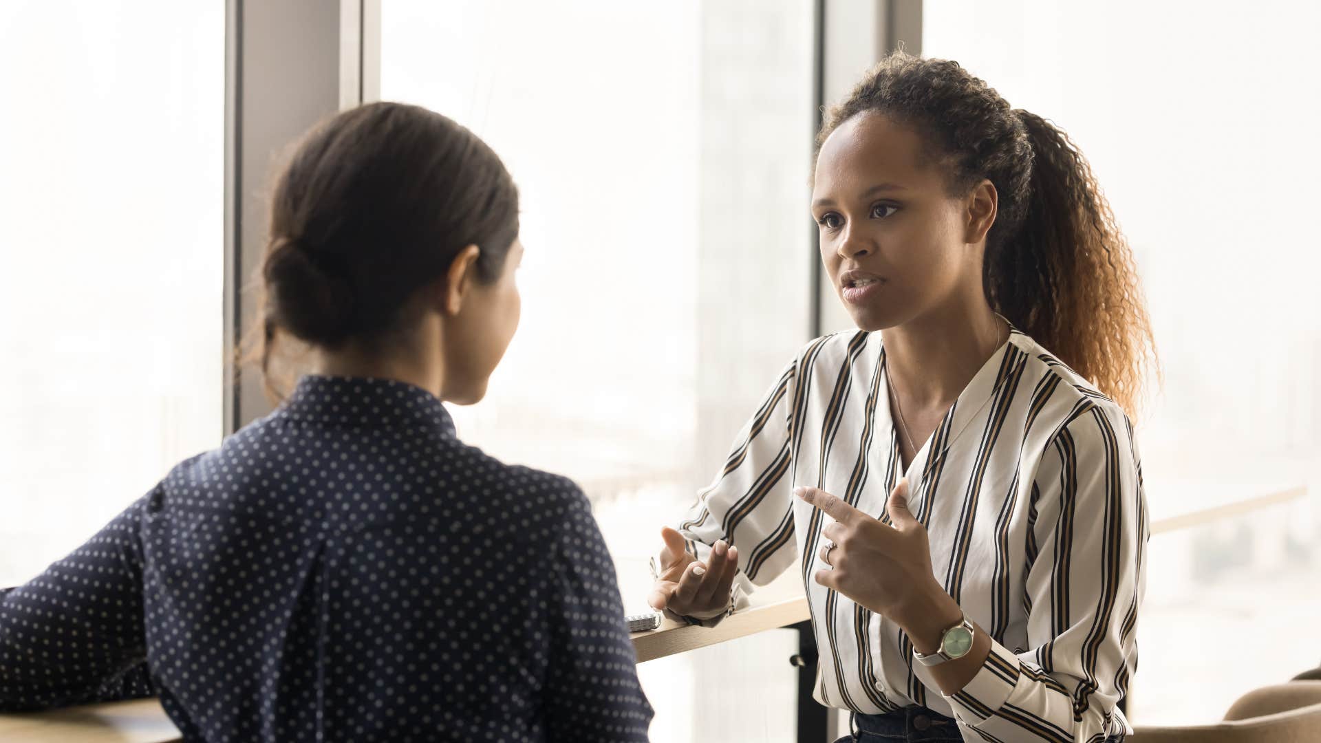 gen z colleagues discussing their salaries together