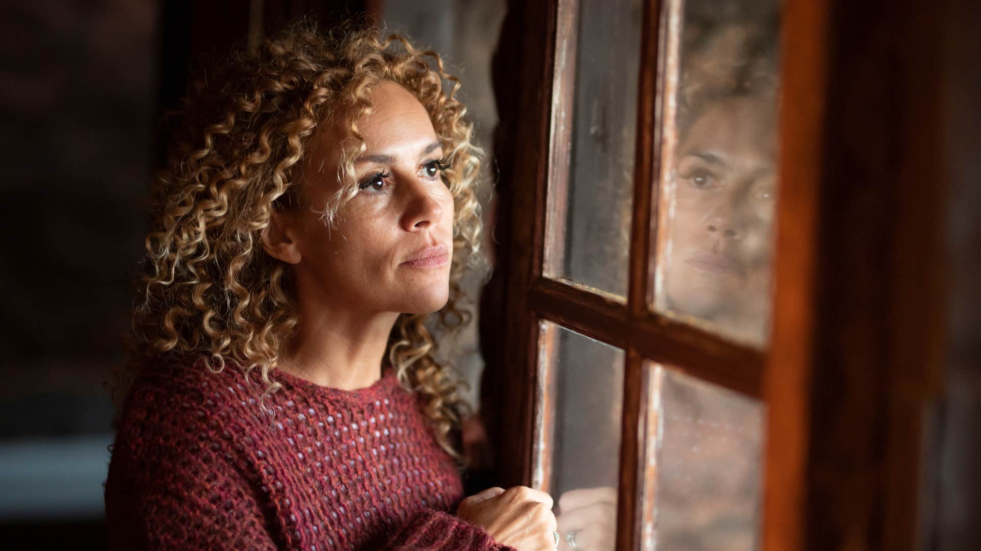 sad woman daydreaming about a different life