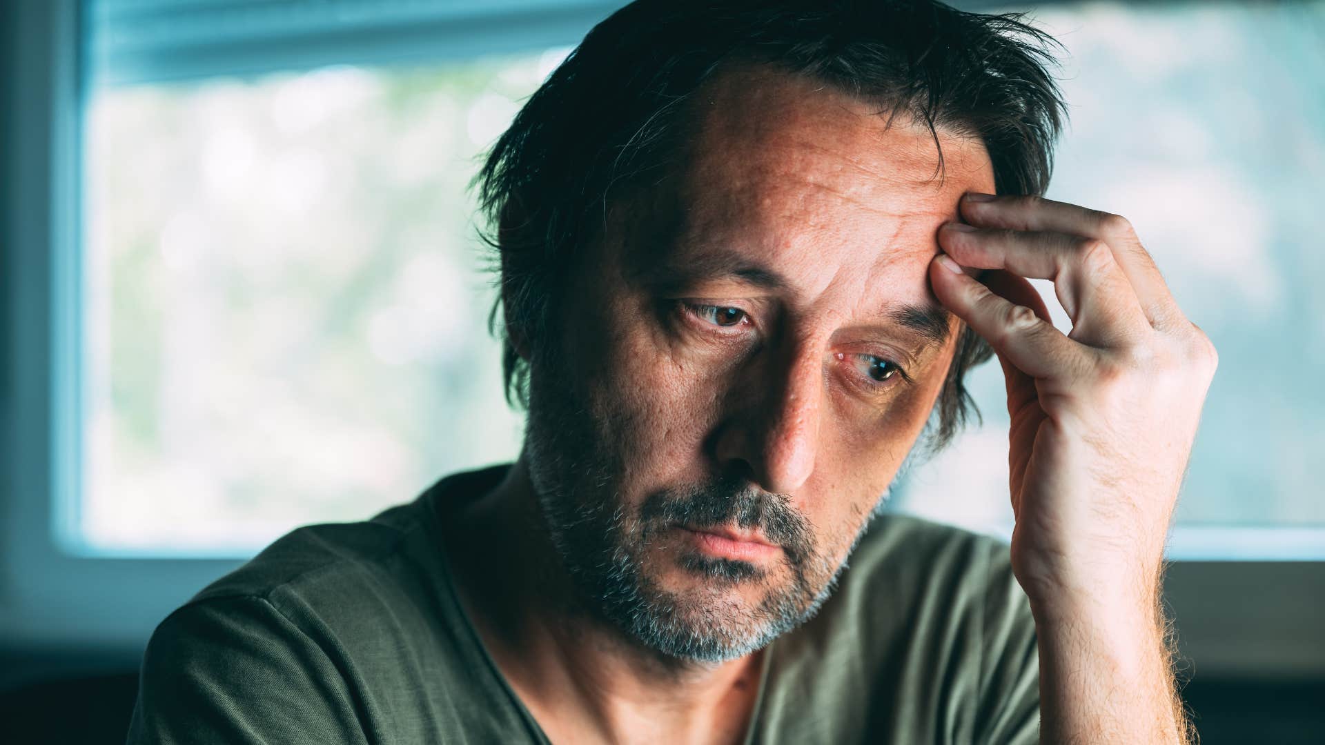 man grieving the old versions of himself before being in a bad marriage