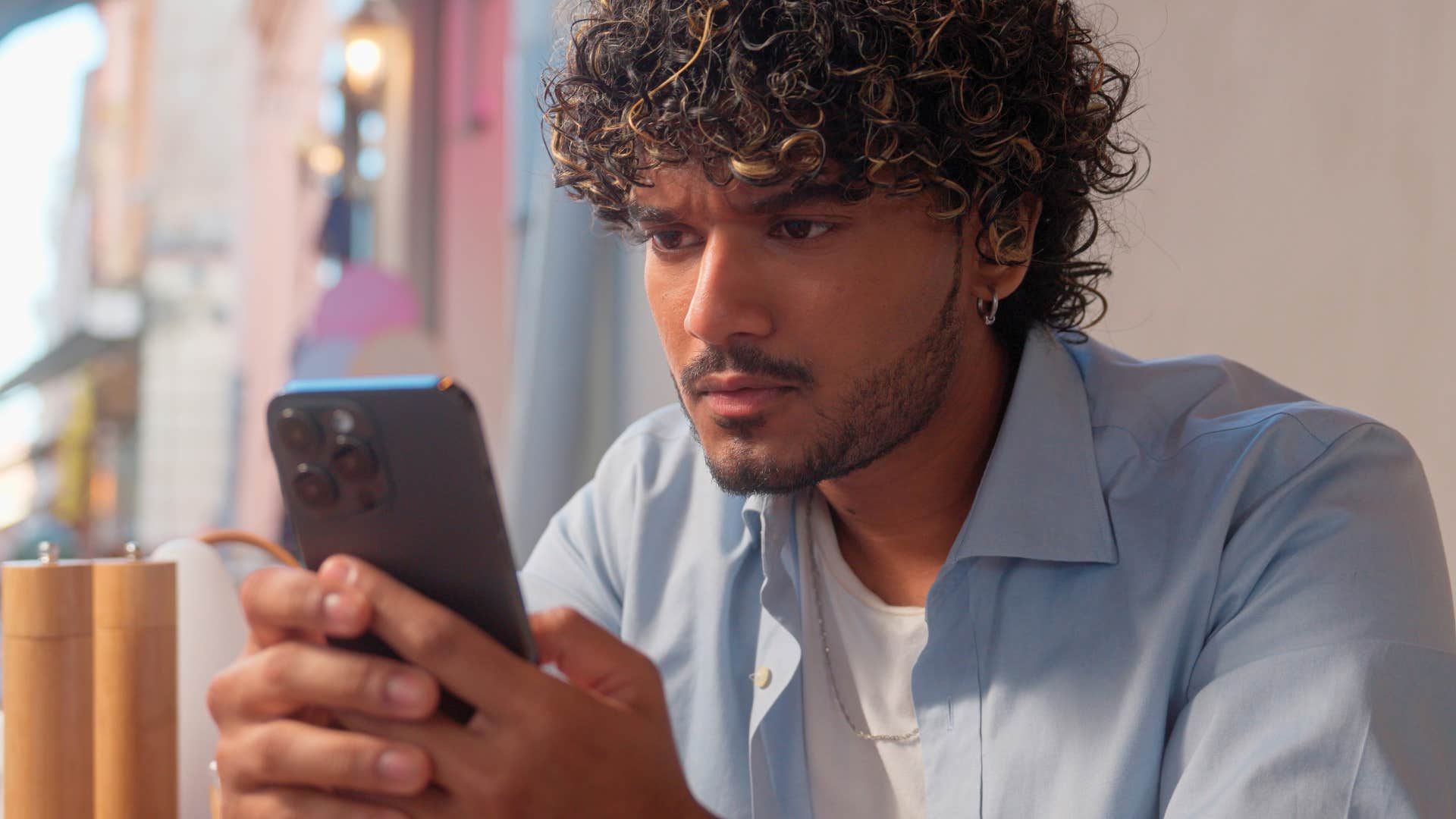 lonely man in a bad marriage scrolling through his ex's social media