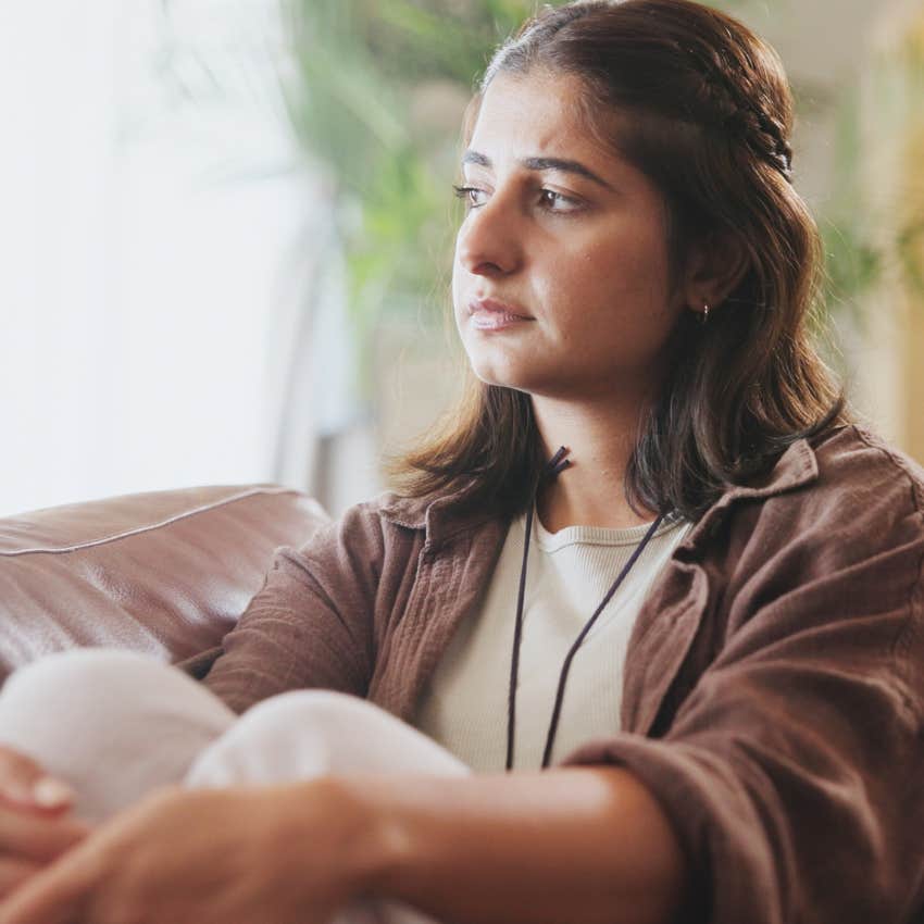 exhausted woman self-isolating at home alone