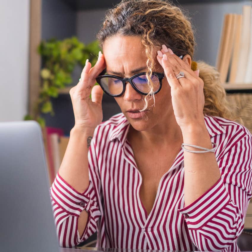 stressed woman who's always running on autopilot at work